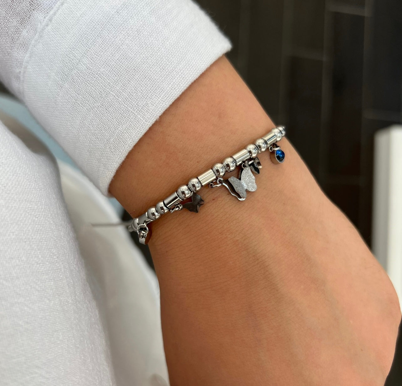 Armband mit Schmetterlings- und Sternanhänger
